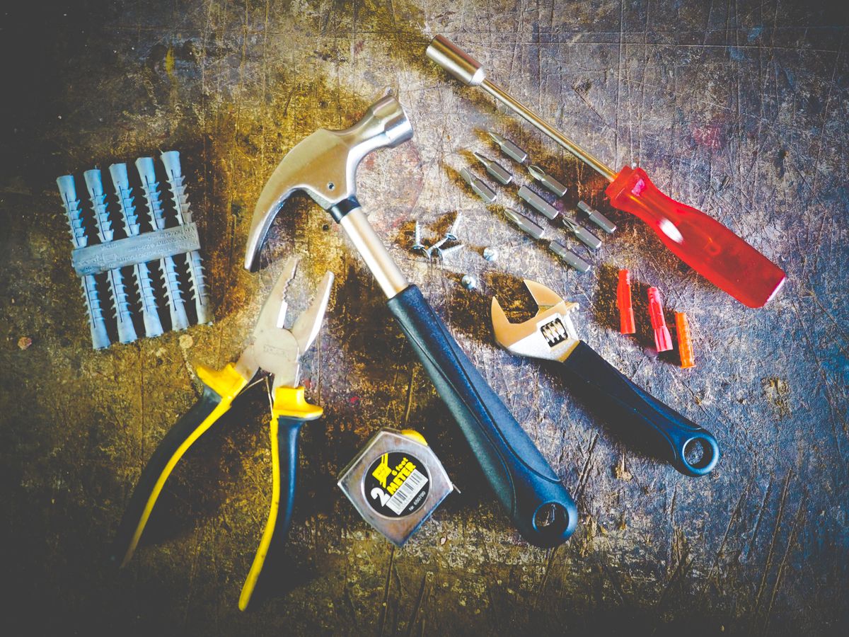 Hand tools laid out on a work surface